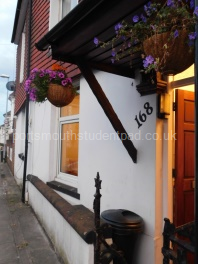 Cosy Entrance with hanging baskets